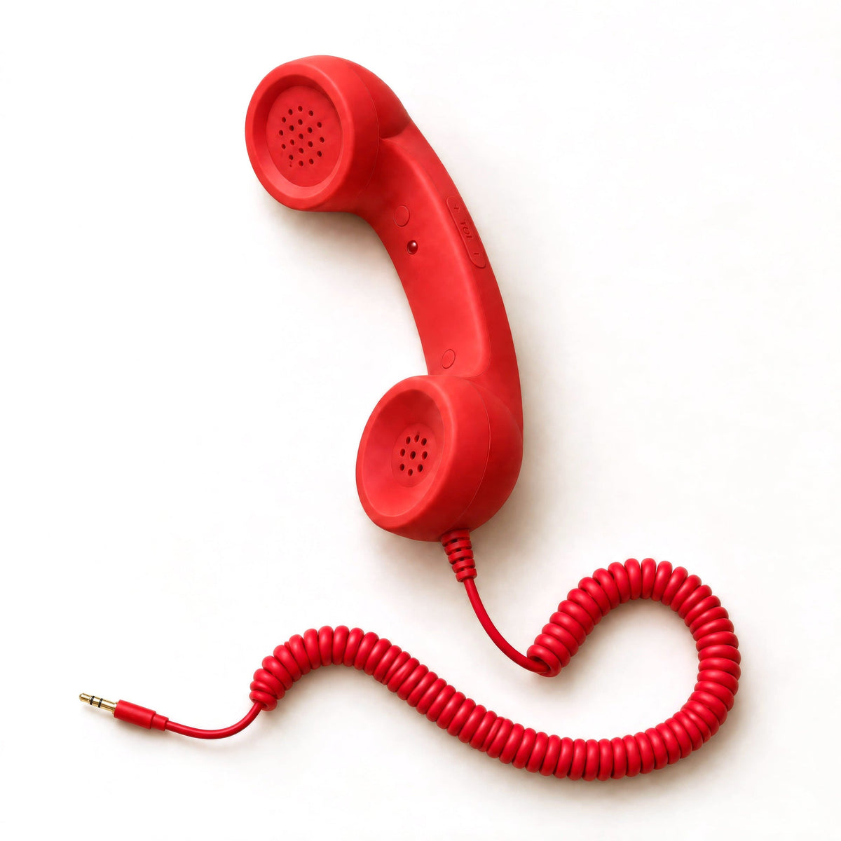 Röd retro telefonlur med spiralsladd till mobilen