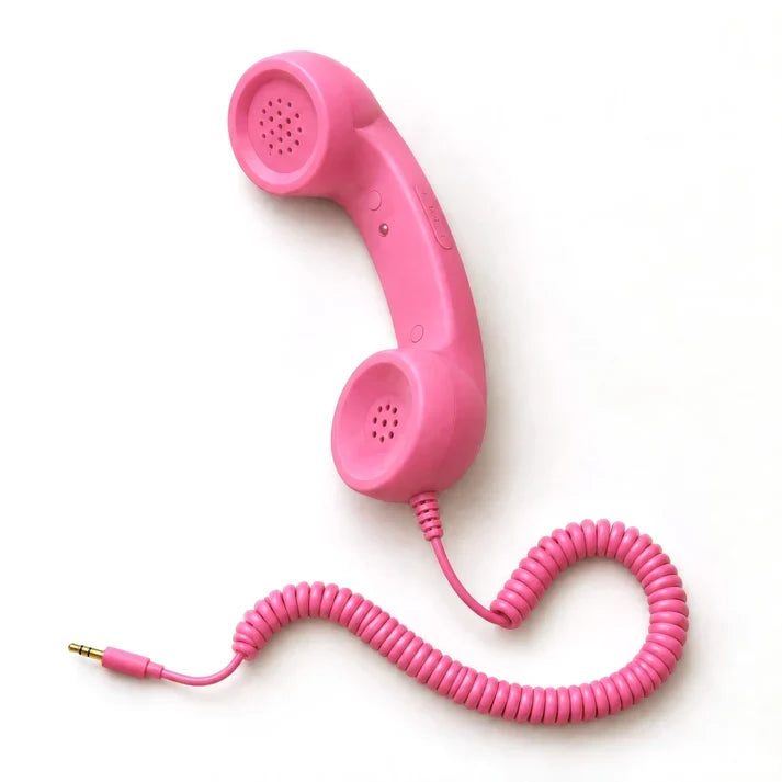 Rosa retro telefonlur med spiralsladd till mobilen